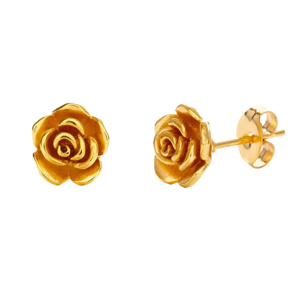A pair of small gold stud earrings shaped like detailed rose blooms with layered petals in a warm gold finish, with push-back closures.
