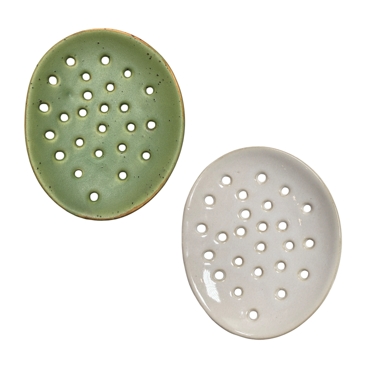 set of 2 round ceramic footed soap dishes with perforated drainage holes, shown in green & white.