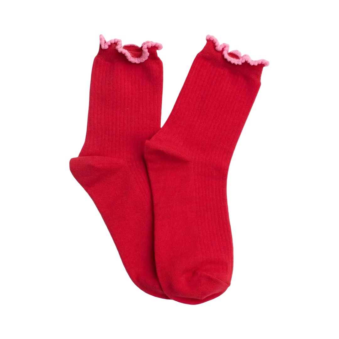 Pair of red socks with pink ruffle trim.