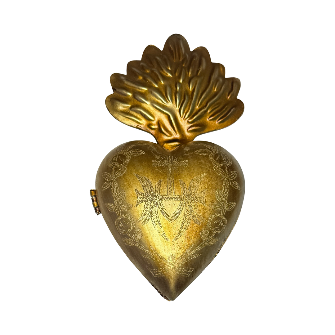 brass heart locket featuring an engraved design.