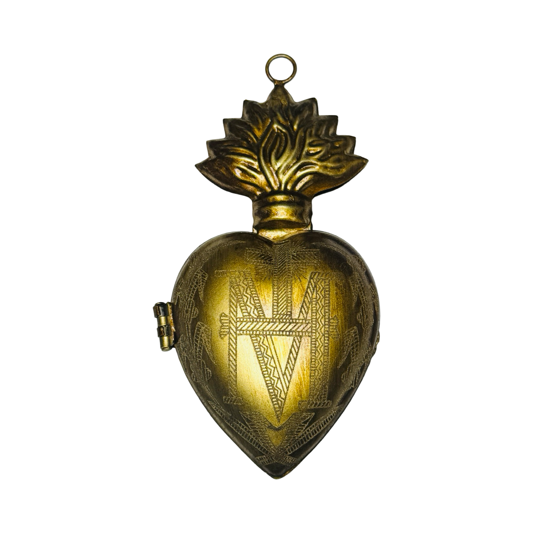 brass heart locket featuring an engraved design.