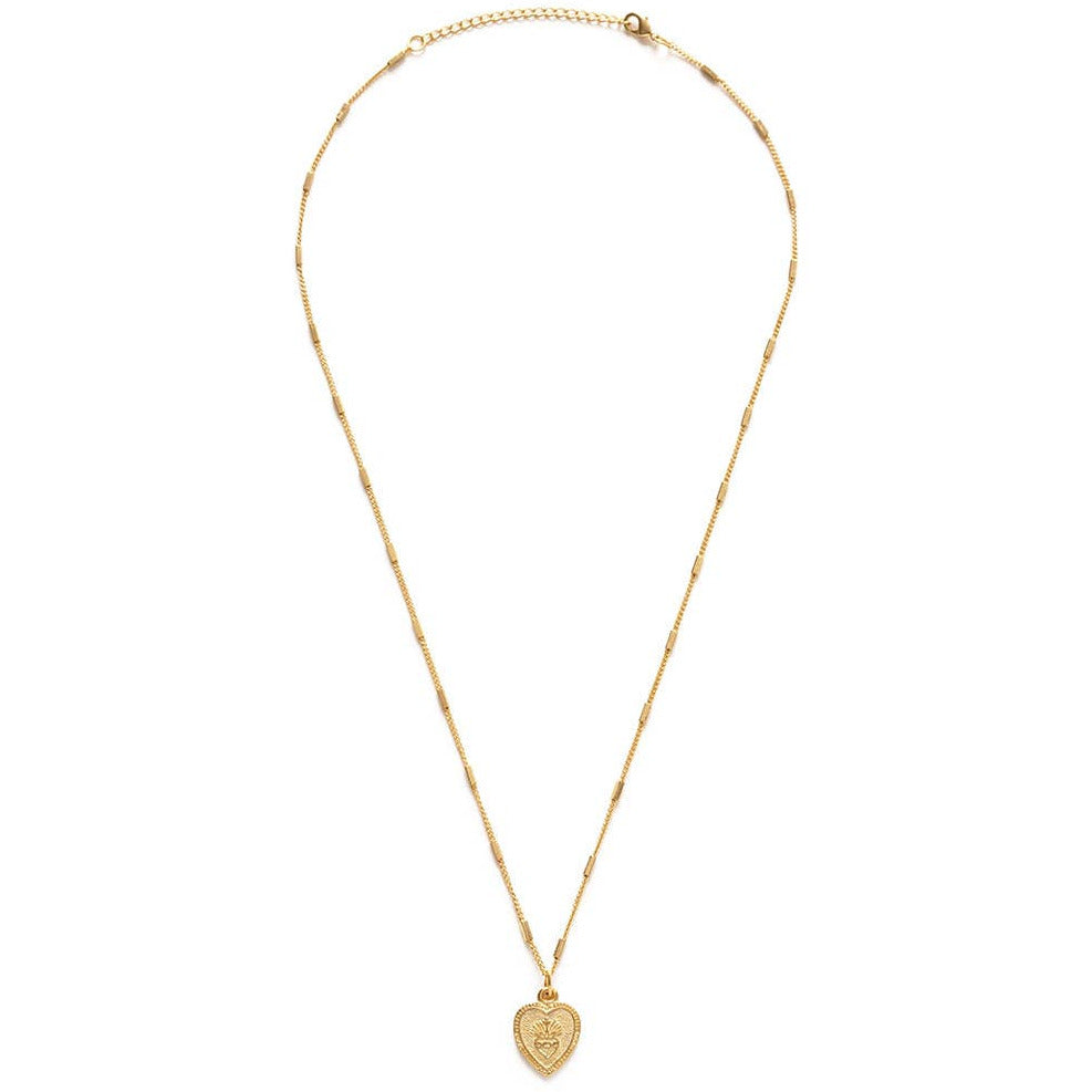 gold heart shaped pendant necklace featuring a sacred heart. Brand: Amano Studio