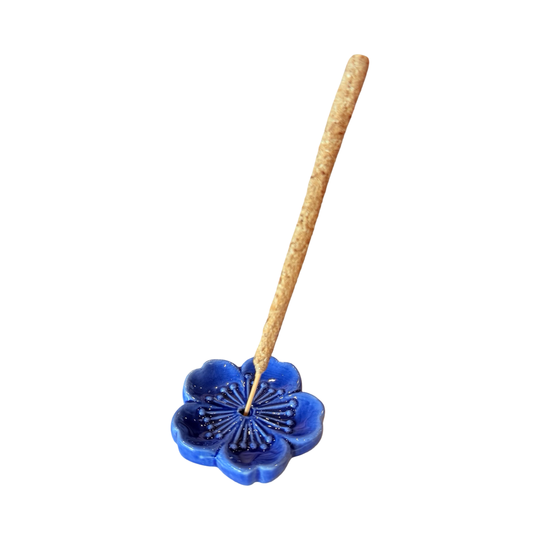 Blue cherry blossom incense holder with an incense stick.