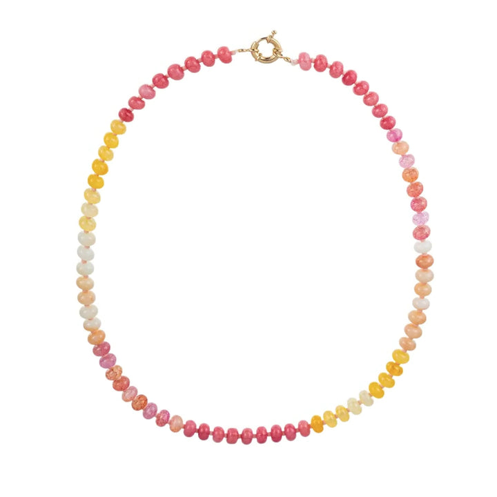A semi-precious glass bead necklace in a gradient of pink, coral, peach, and yellow tones with a gold spring ring clasp.