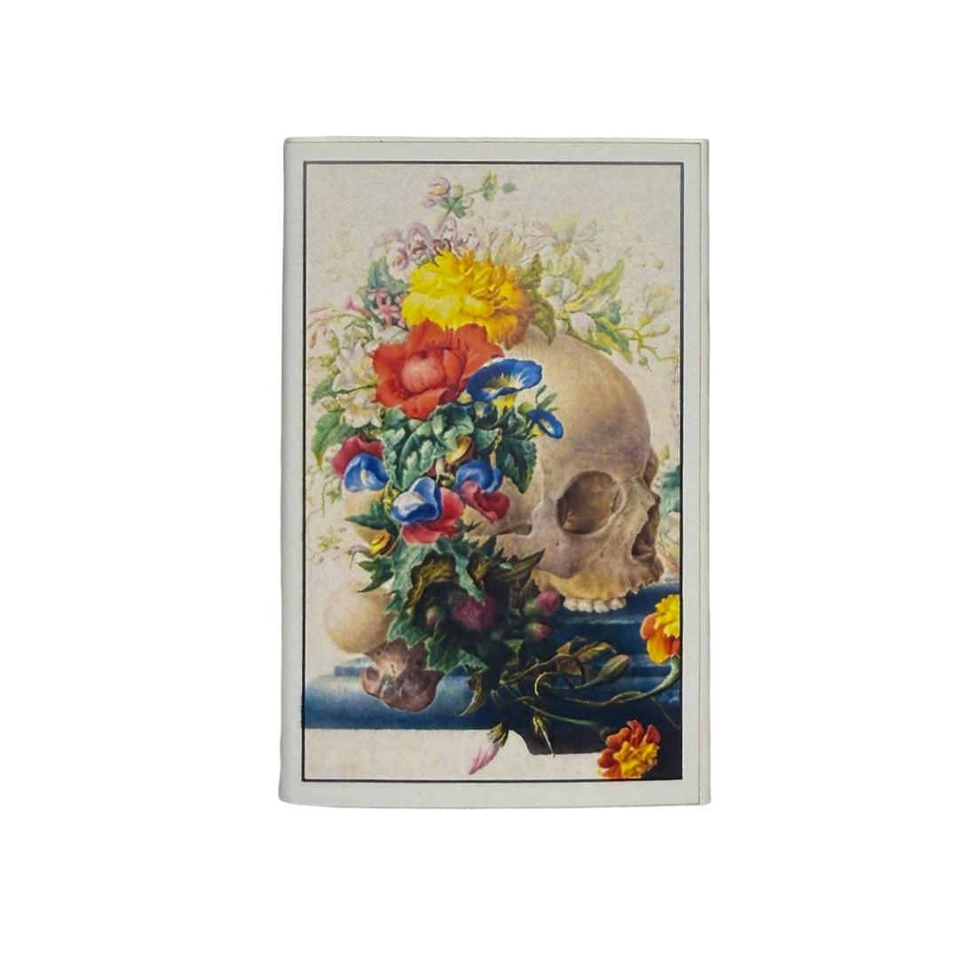 Card with a skull and colorful flowers on a white background