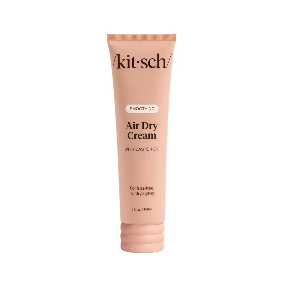 Blush-pink /kitsch/ tube labeled “Smoothing Air Dry Cream with Castor Oil by Kitsch.