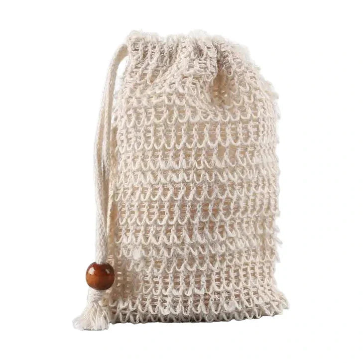 Natural woven soap saver bag with a drawstring and wooden bead, standing upright.