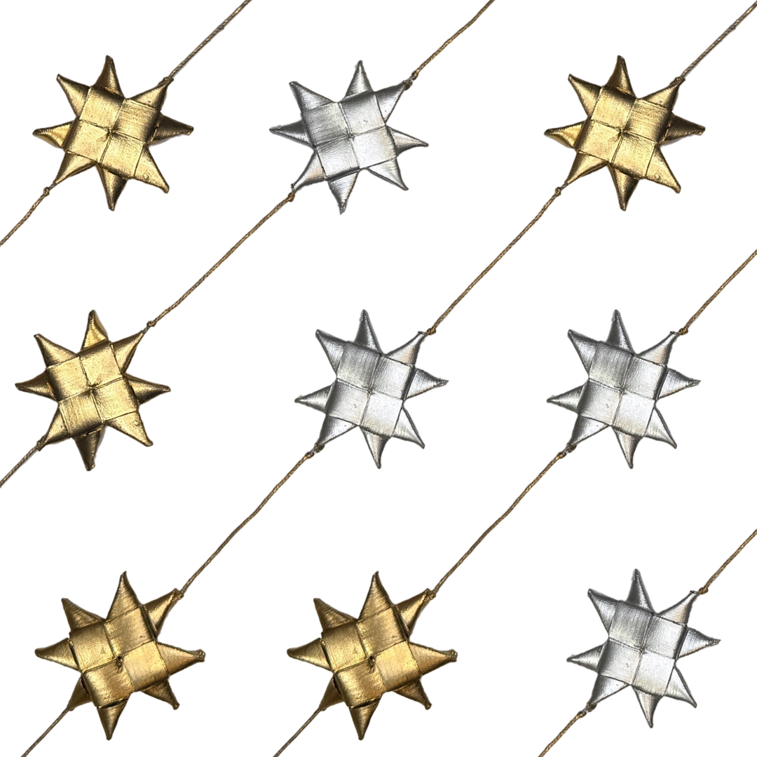 Garland with alternating handwoven metallic gold and silver palm stars strung along a thin cord.