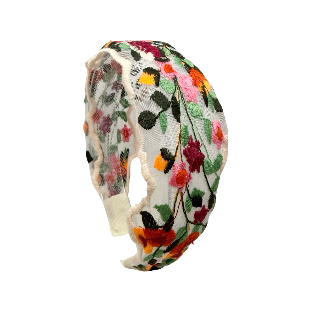 Sheer floral embroidered headband with colorful stitched flowers and leaves along the band.
