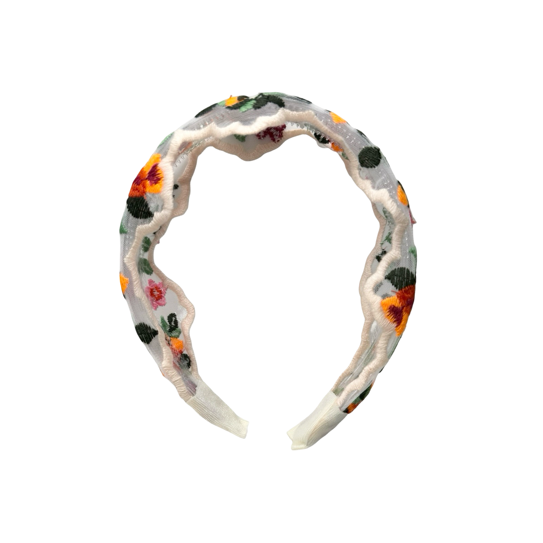 Front view of sheer floral embroidered headband with colorful stitched flowers and leaves along the band.