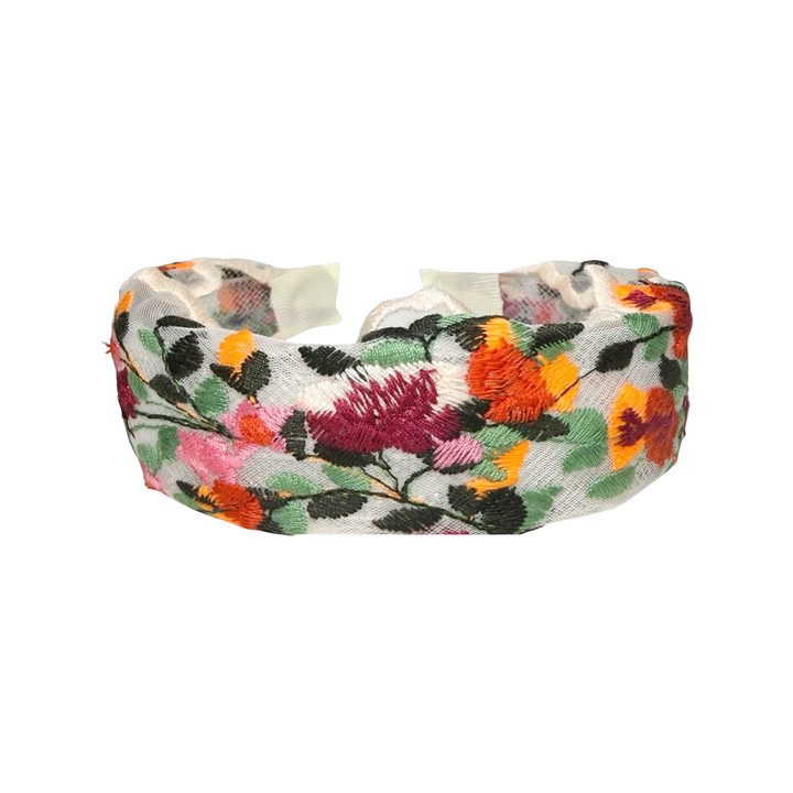 top view of a Sheer floral embroidered headband with colorful stitched flowers and leaves along the band.