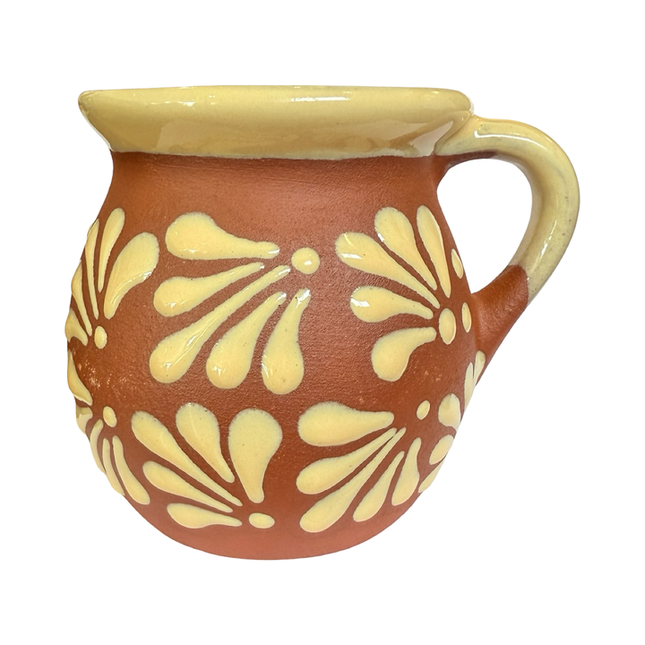 Terracotta mug with a cream glazed talavera design. 
