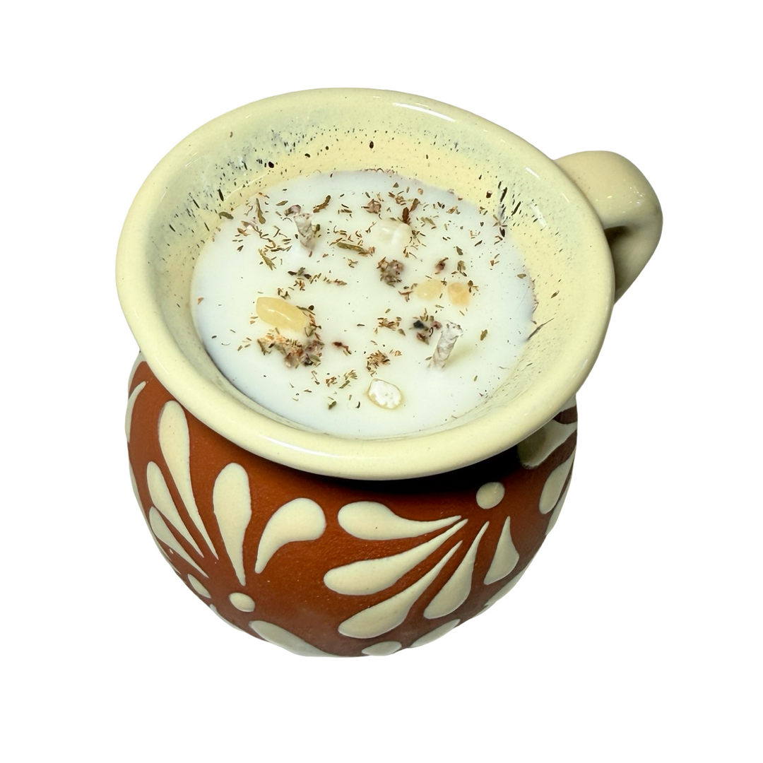 Terracotta mug with a cream glazed talavera design. Featuring crystals and dried flowers in the wax.