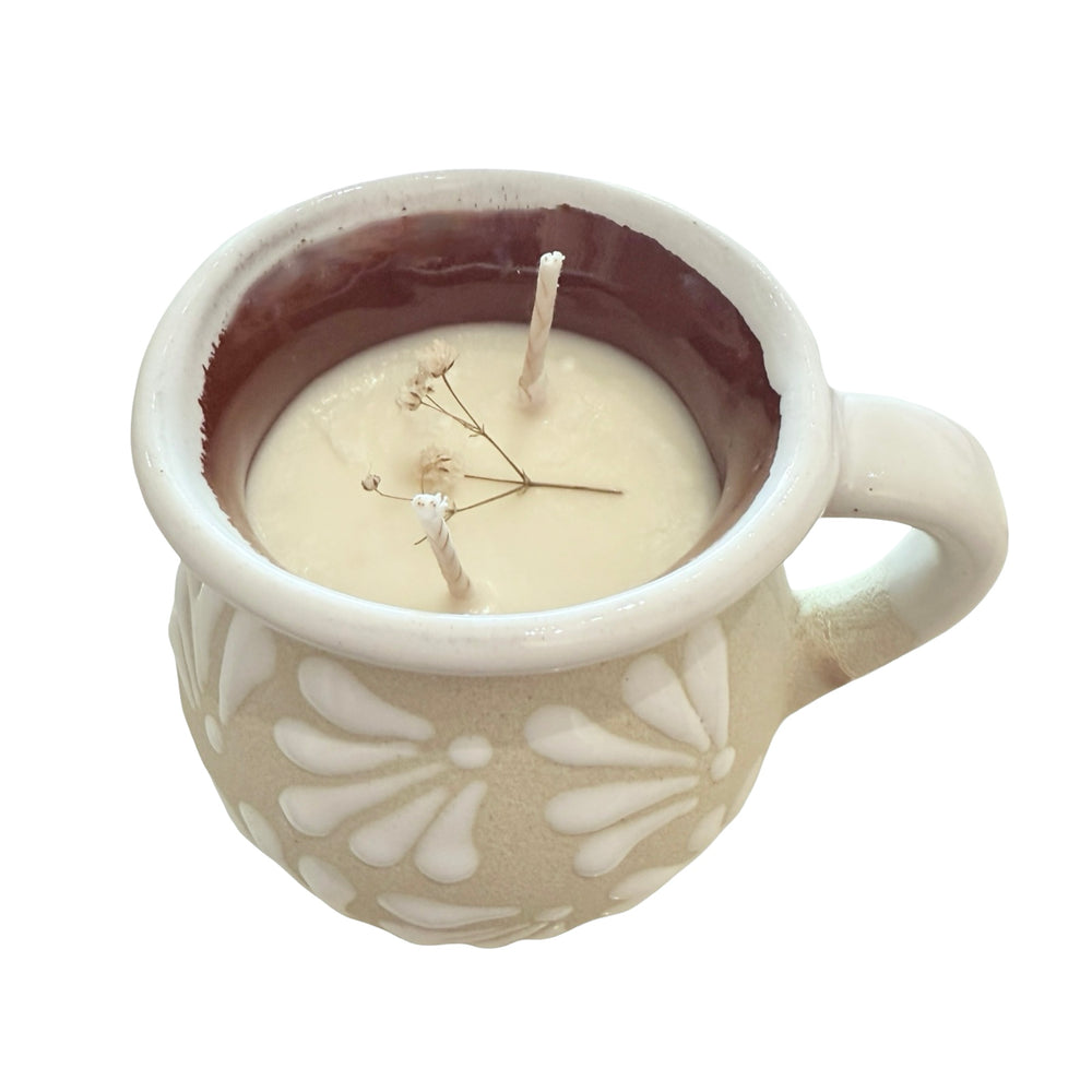 Ceramic mug with a candle inside