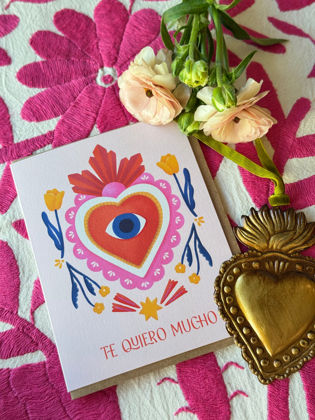 Card with heart design and flowers on a pink floral background