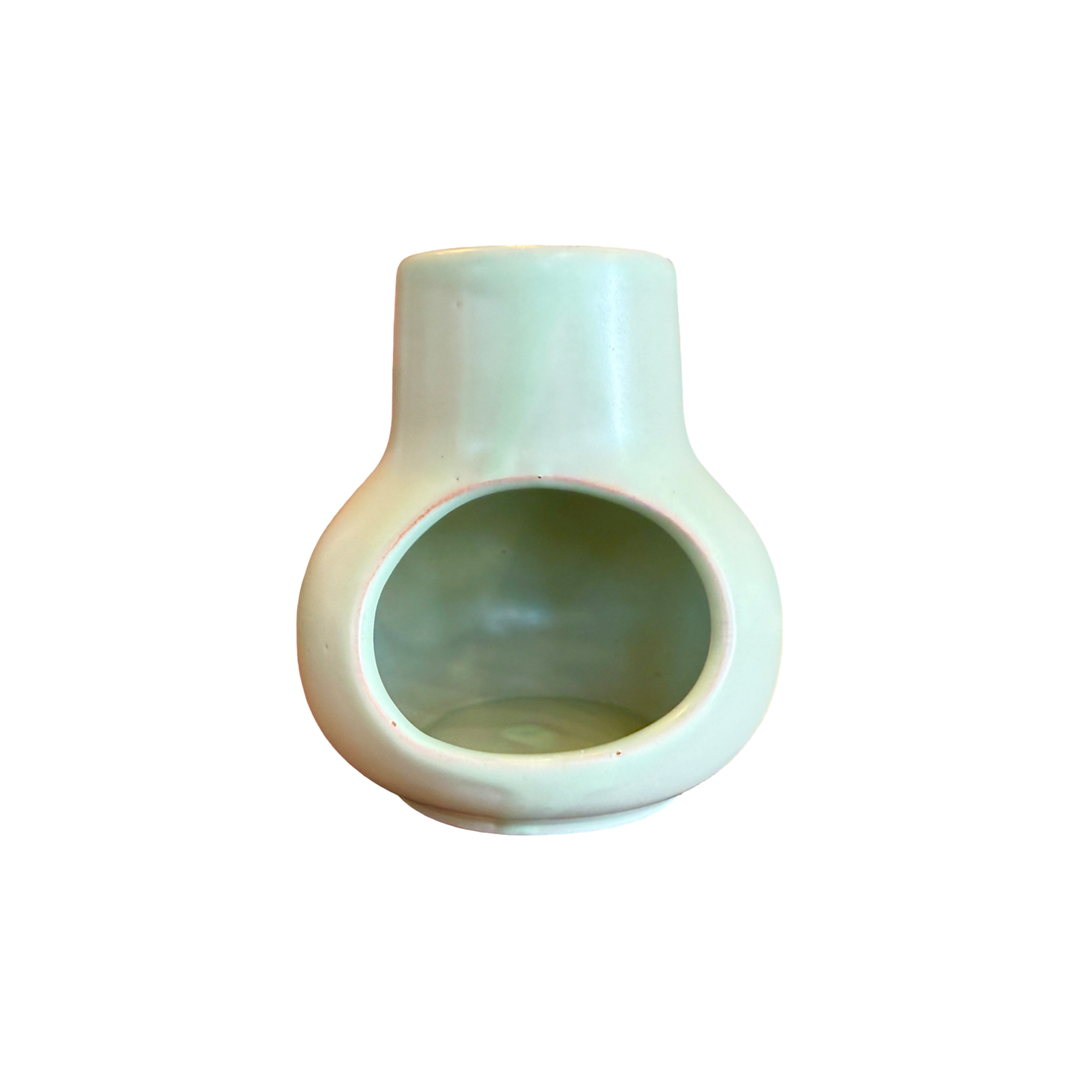 front view of a teal ceramic mini chimney