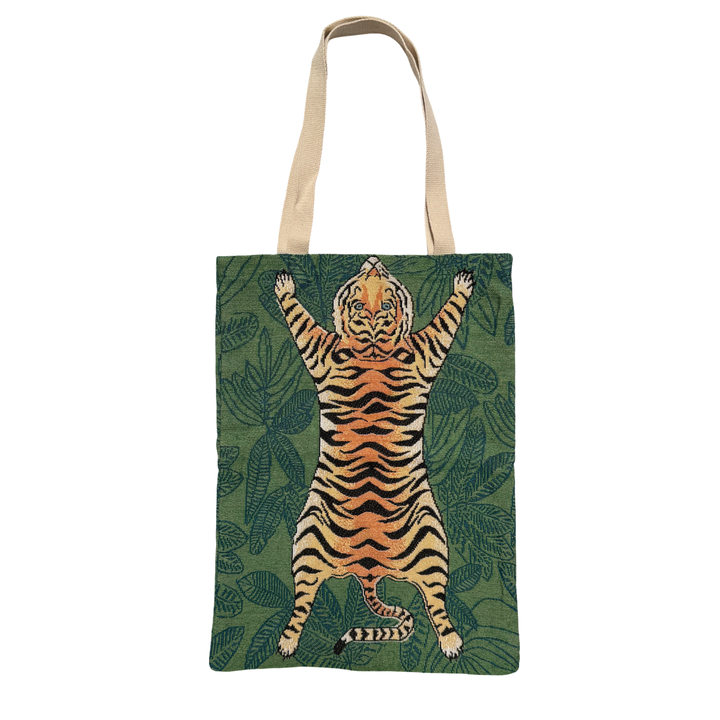 Green fabric tote bag with a leaf background design and an image of a sprawled out tiger featuring tan handles.