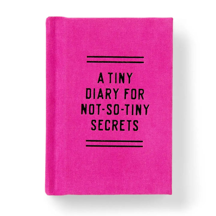 A small hot pink hardcover diary with bold black text reading A Tiny Diary for Not So Tiny Secrets.