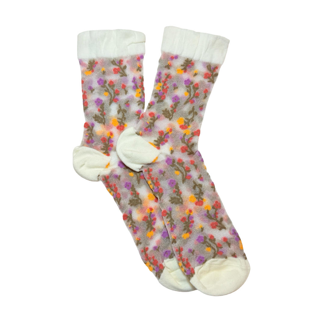 Mesh socks with a colorful floral design and cream cuff, heel and toe.