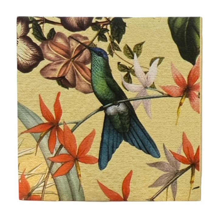 Yellow square matchbook featuring a single green hummingbird perched on a branch surrounded by orange, yellow and pink flowers.