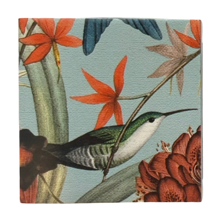 Light blue square matchbook featuring a single green and white hummingbird perched on a branch surrounded by orange, green and white flowers.
