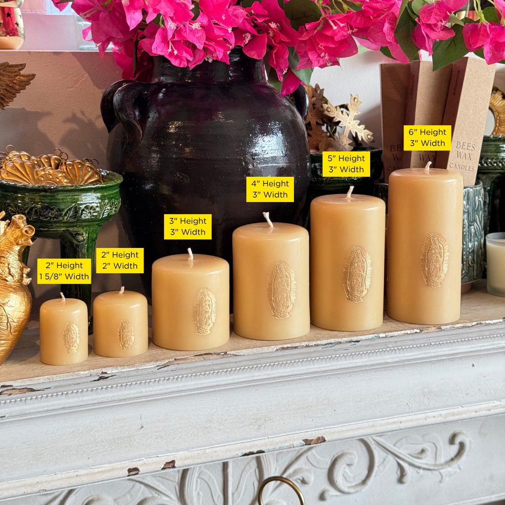 A set of natural beige pillar candles in graduated sizes arranged on a white mantel, with yellow size labels indicating height and width. 