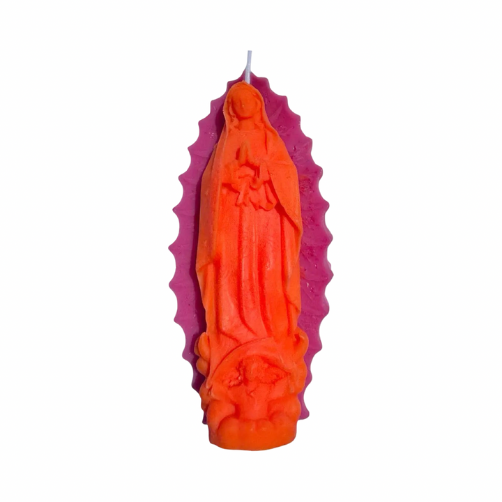 Bright pink and orange embossed Virgen de Guadalupe figural candle with detailed relief and decorative halo.