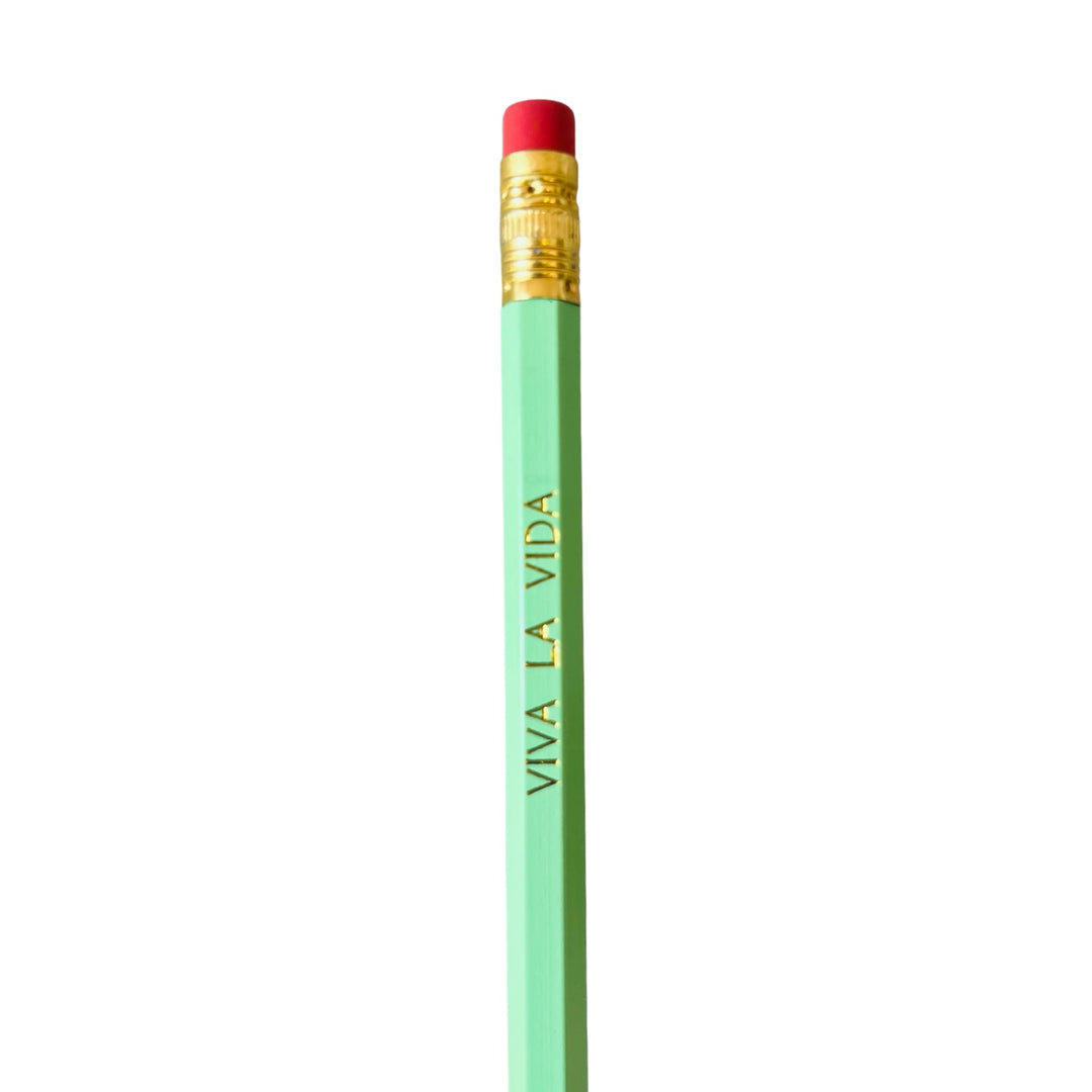 A green pencil with the phrase 'VIVA LA VIDA' printed in gold lettering along its body, topped with a gold ferrule and a red eraser.