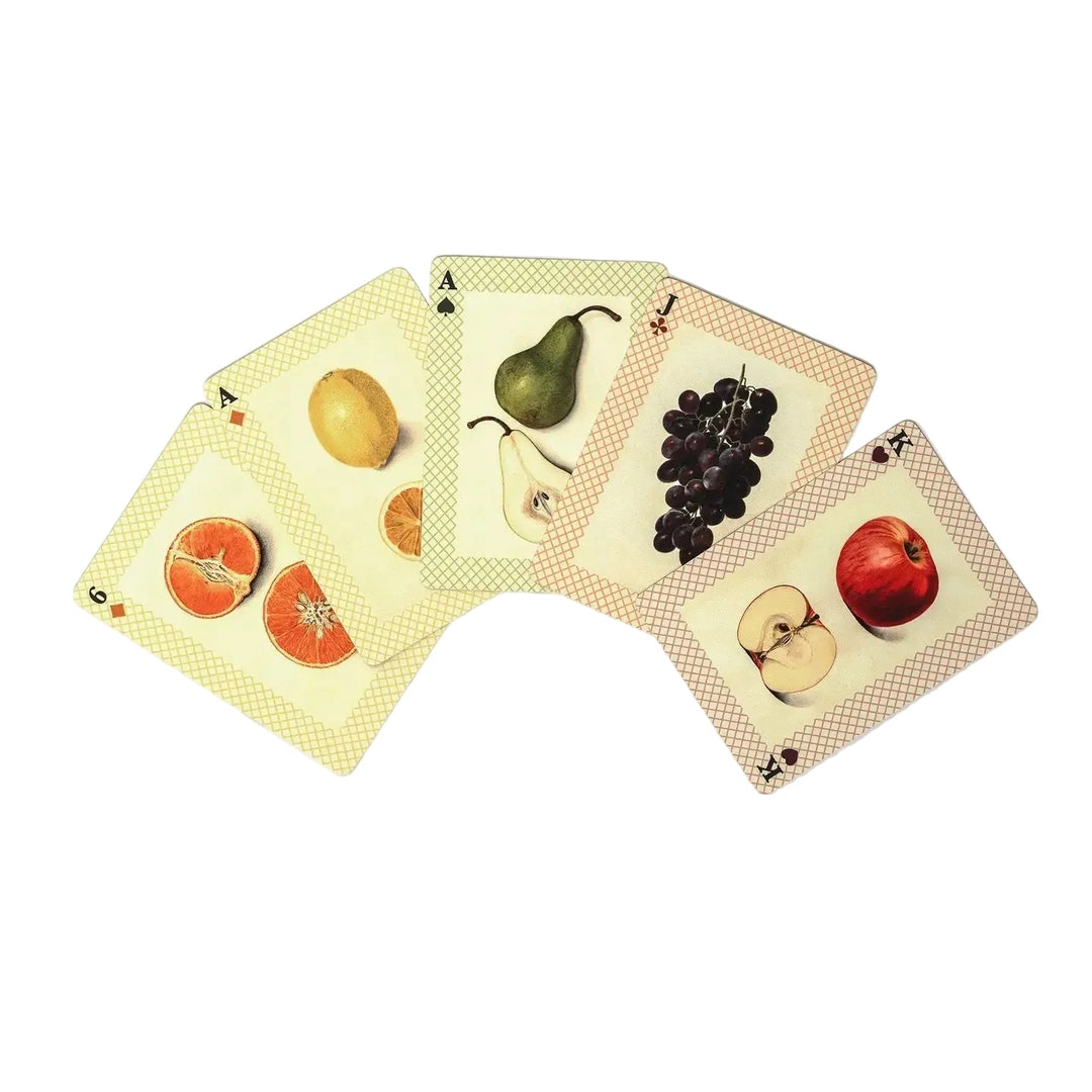 Four Watercolour Fruits playing cards from the Roomytown deck fanned out, each featuring a vintage-style illustration of a different fruit including oranges, lemon, pear, grapes, and apple