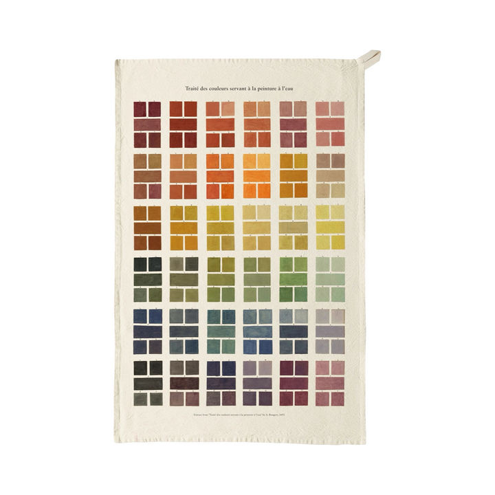 Tea towel featuring a grid of watercolor paint swatches in a range of colors with French text printed at the top.
