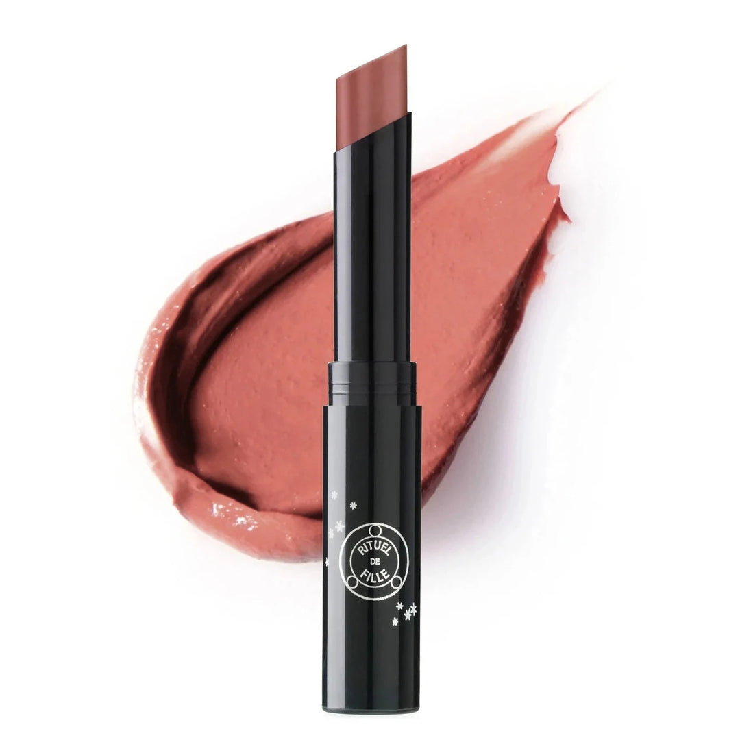 black branded tube of rose shade lipstick with a color swatch behind it. Brand: Rituel De Fille