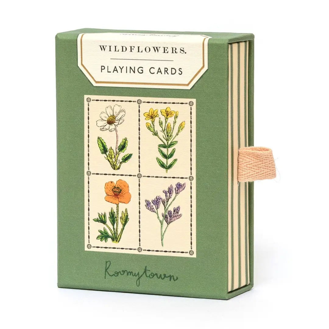 Wildflowers Playing Cards by Roomytown in a sage green slide-out box featuring four botanical wildflower illustrations on the front and a natural woven ribbon pull tab on the side.