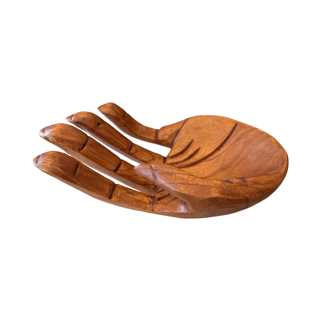 Side view of an open wooden hand.