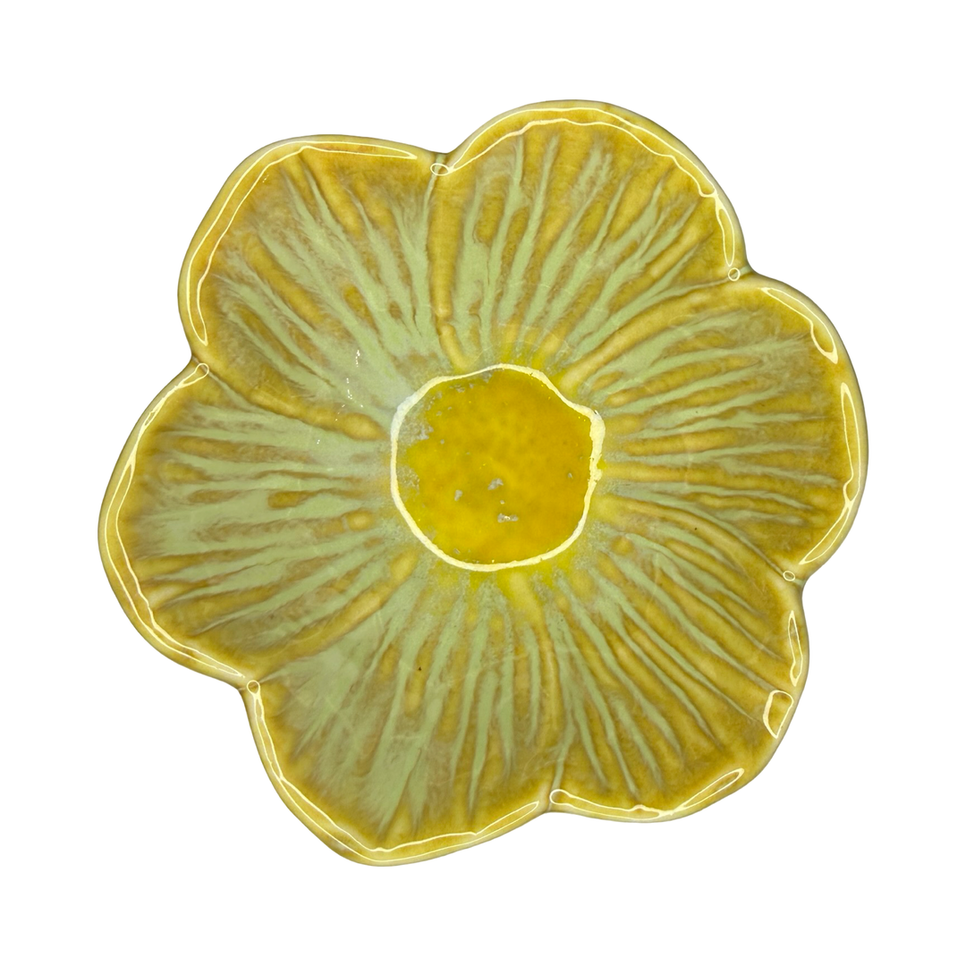 Stoneware flower-shaped bowl in mustard yellow with a golden center glaze.