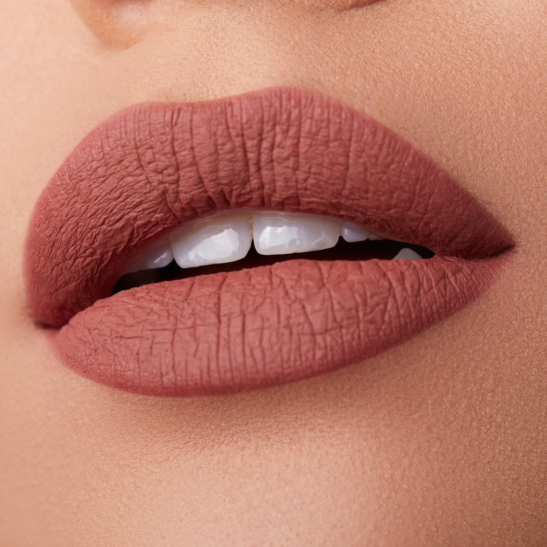 close up of a pair of lips with pink lipstick. Brand: Araceli Beauty