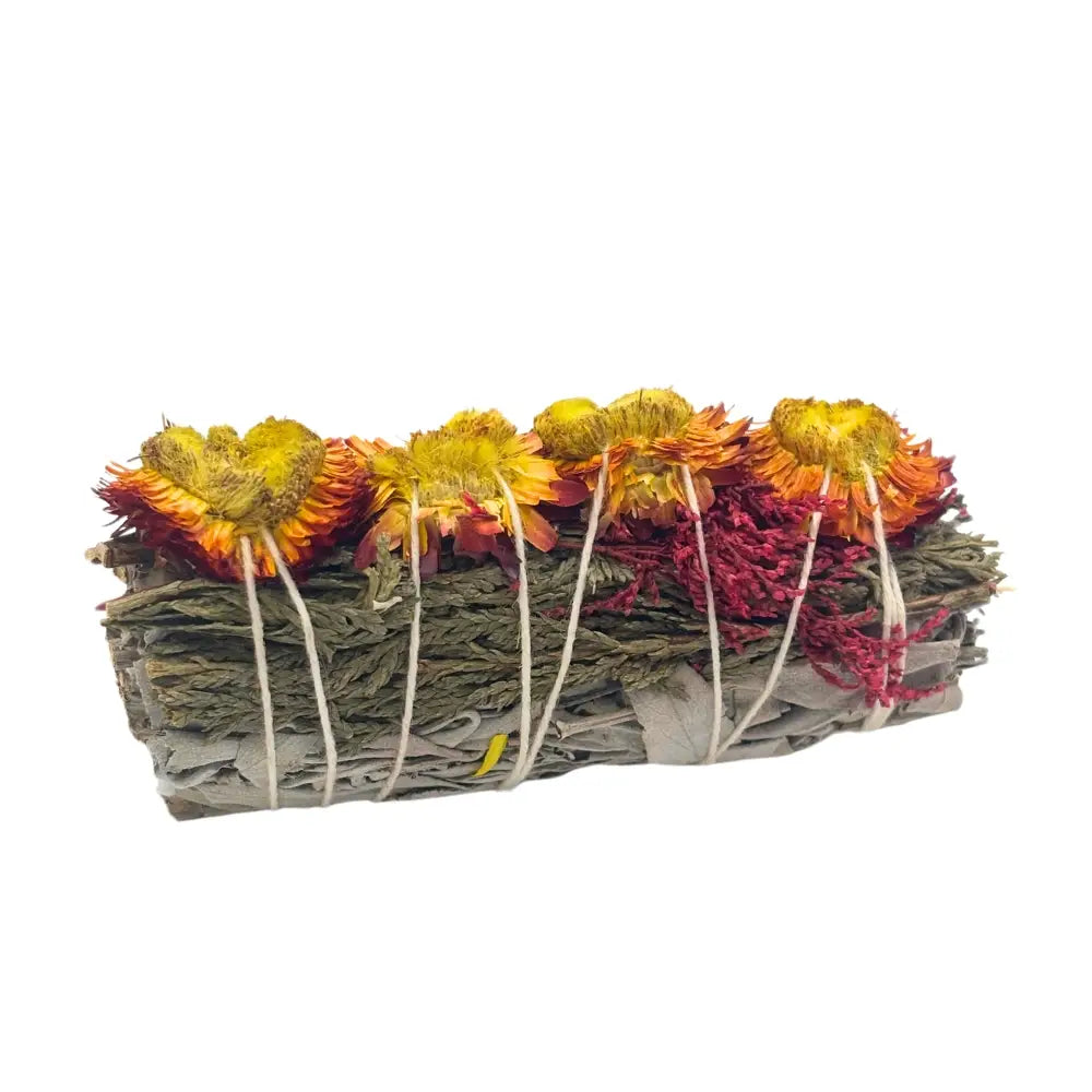 Sage bundle wrapped with dried orange strawflowers and natural string.
