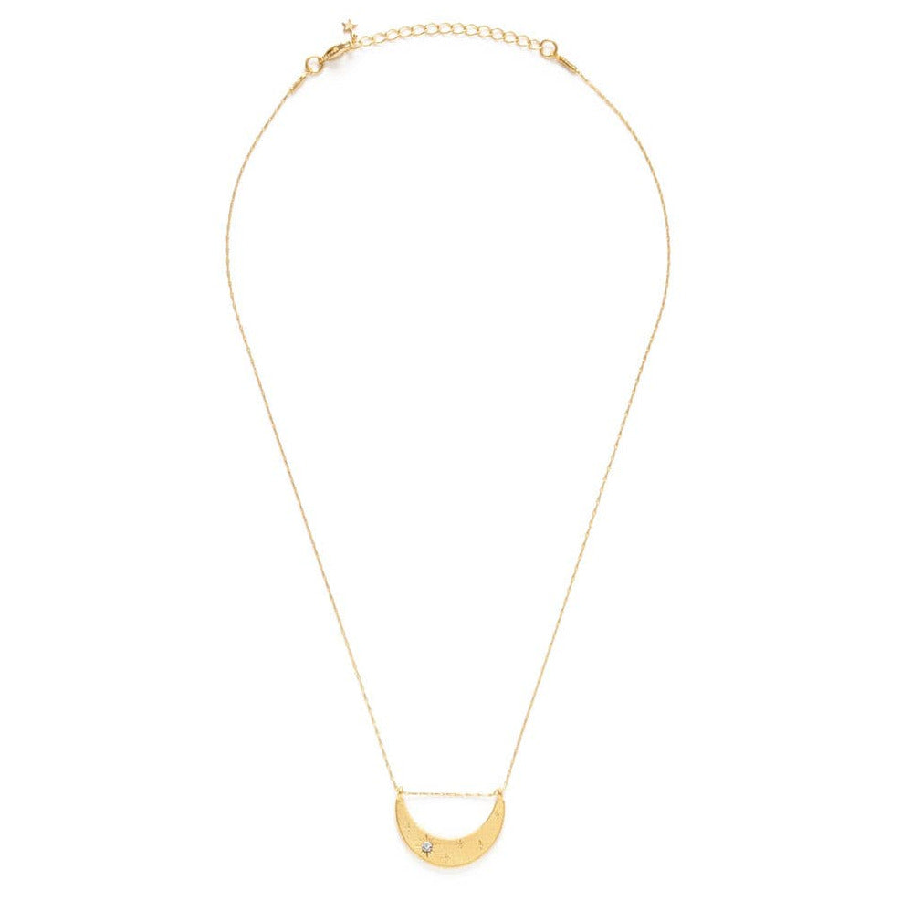 gold crescent moon necklace featuring a crystal. Brand: Amano Studio