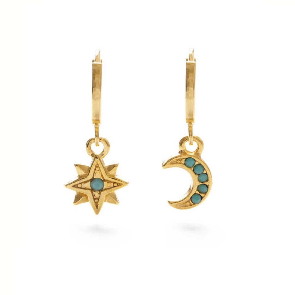 set of gold earrings in the shape of a moon and star featuring a turquoise in the center. Brand: Amano Studio