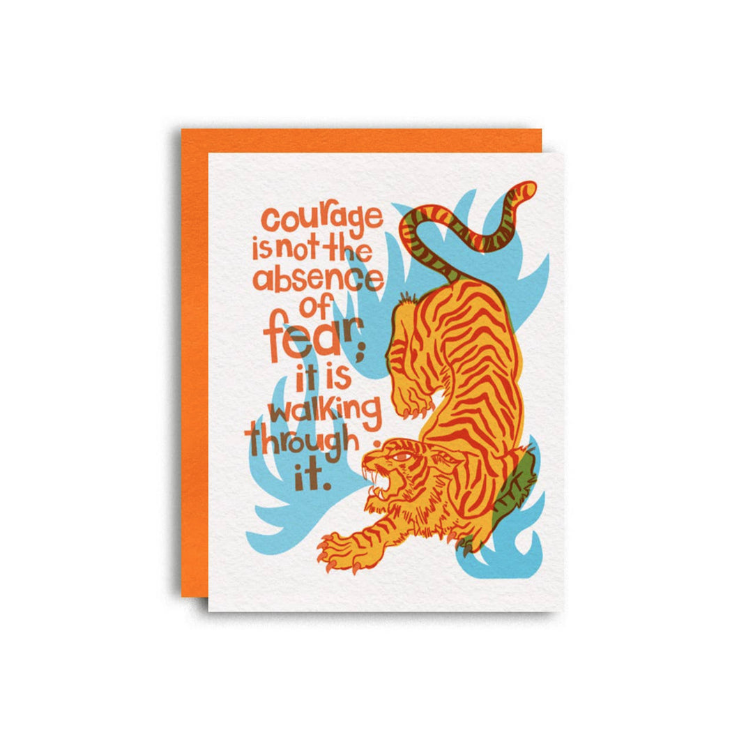 white card with an orange and red tiger with blue flames featuring the phrase Courage is not the absebce of fear; it is walking through it, in orange lettering