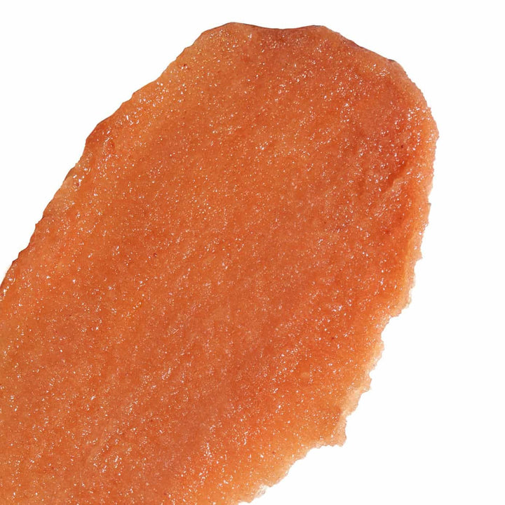 Close up texture of Nopalera Cactus Body Polish in a warm orange sugar scrub consistency.