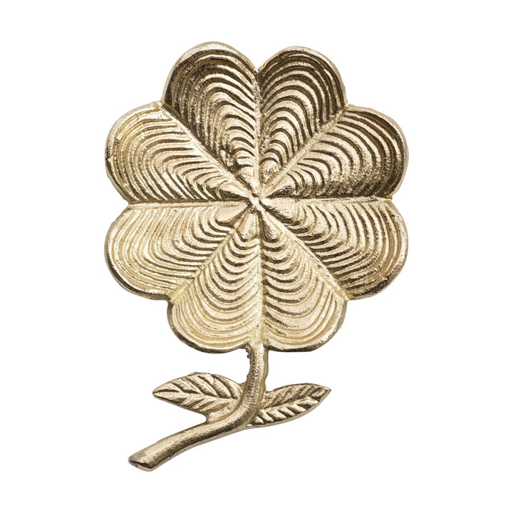 Metallic flower shaped dish with detailed petals and a sculpted stem, shown from a top view.