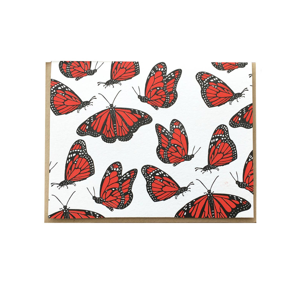 white card with monarch butterflies and a brown envelope