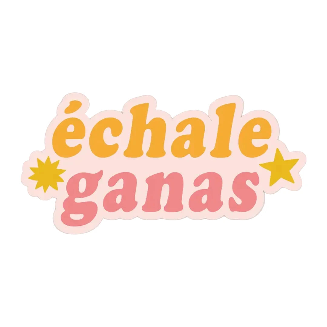 A die cut sticker with "échale ganas" in retro bold lettering, "échale" in orange and "ganas" in pink, on a blush background with gold star accents.
