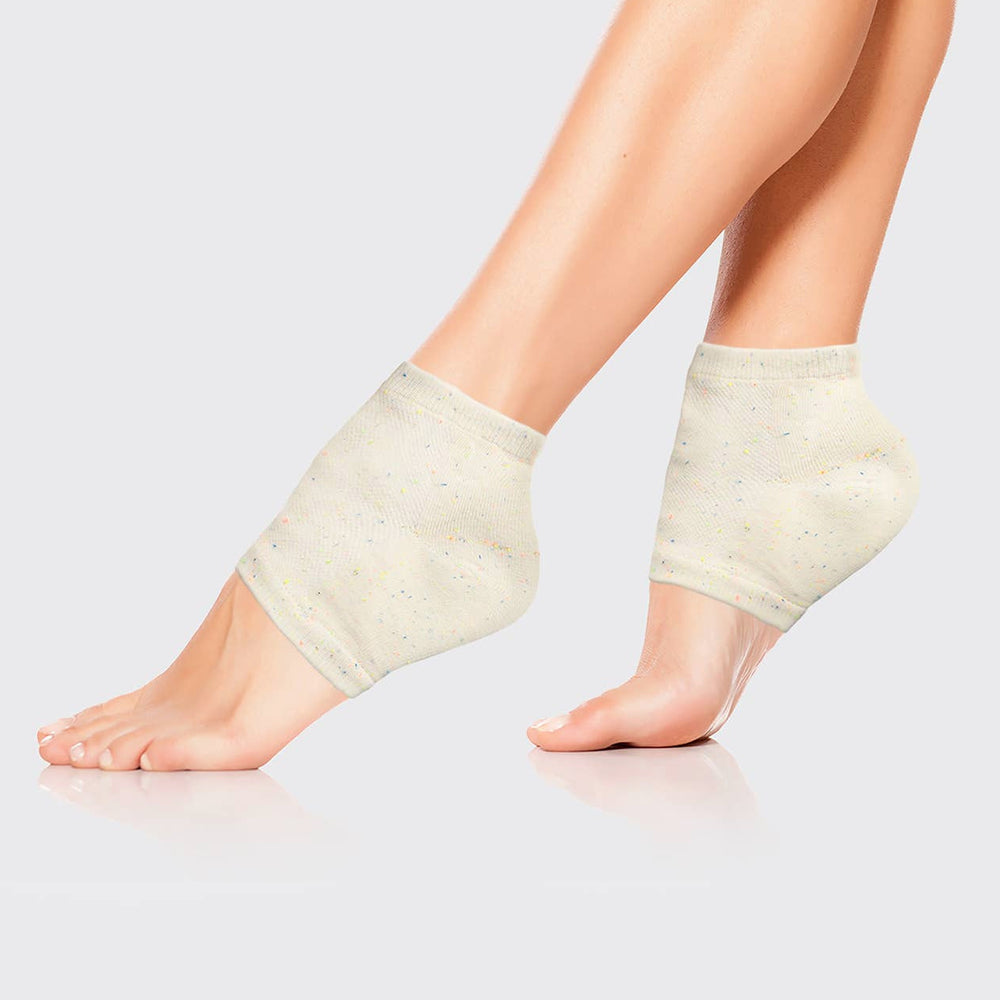 pair of luminous feet wearing cream colored heel socks. Brand: Kitsch