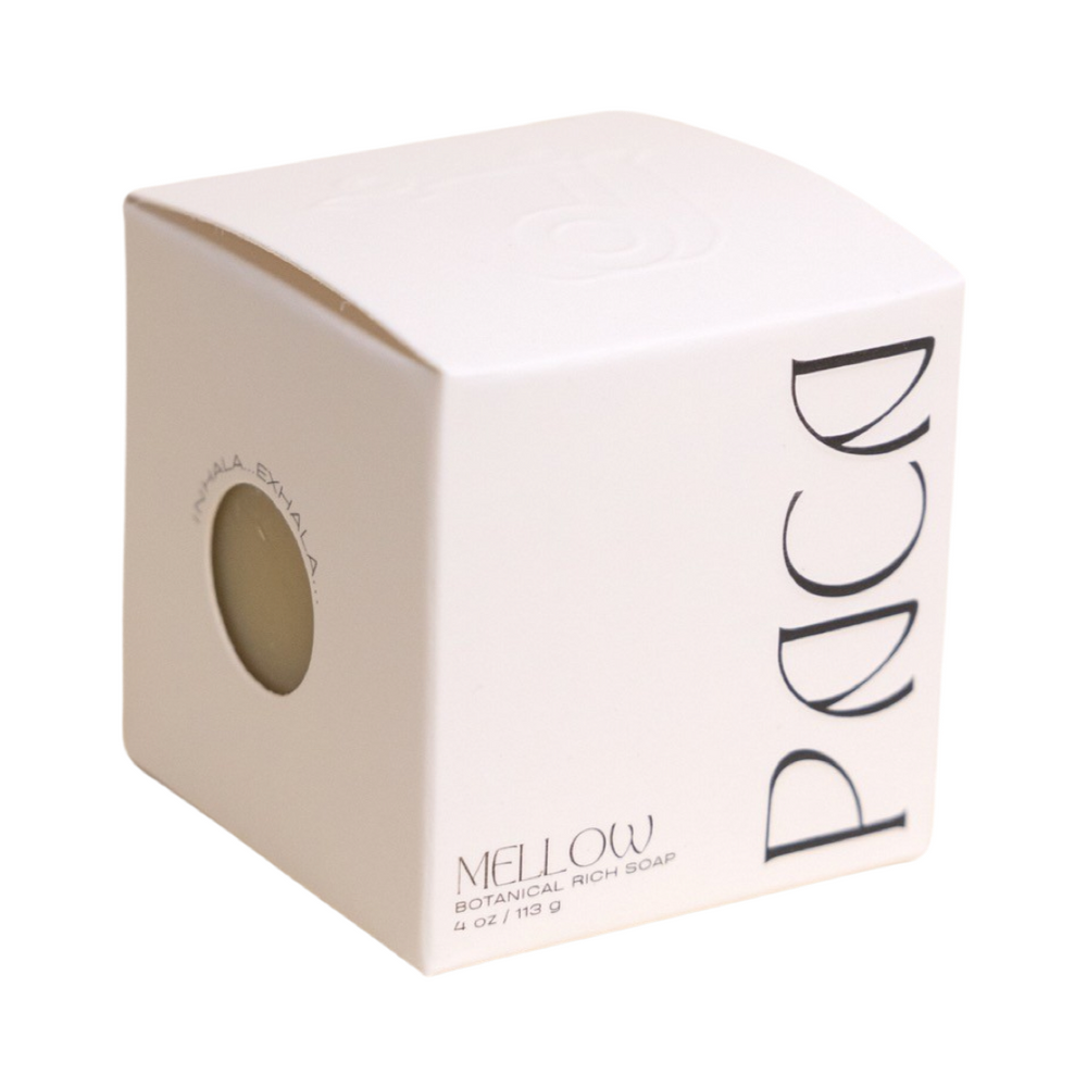 white branded cube shaped box with black lettering. Brand: Paca Botánica