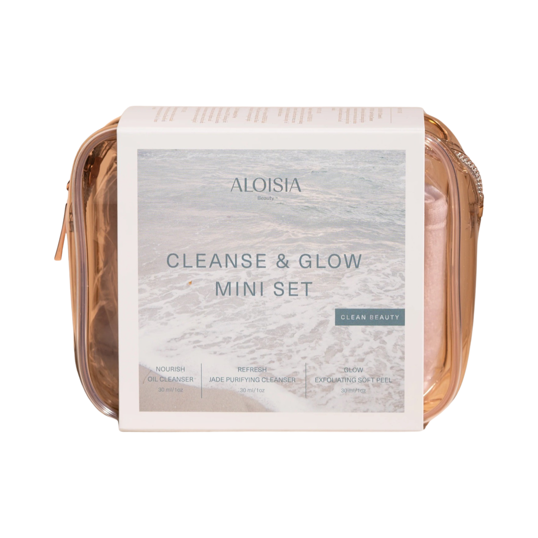 clear light pink bag with a white branded label that features an image of the beach and ocean waves. Brand: Aloisia Beauty