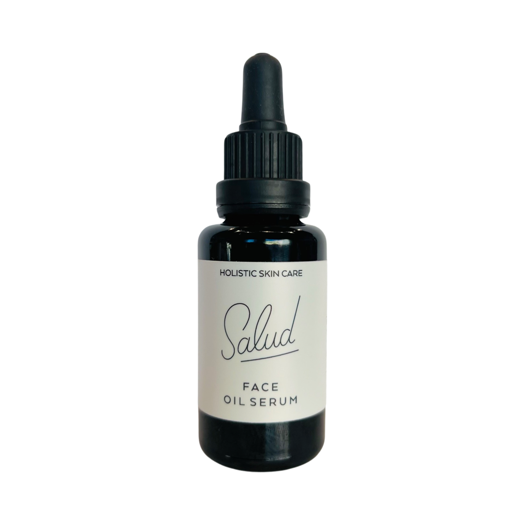 1 oz dark brown bottle of Salud Face Oil Serum with a white branded label. Brand: Salud