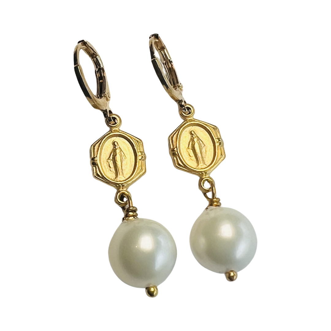 set of earrings with a Virgin Mary medallion and a single pearl drop