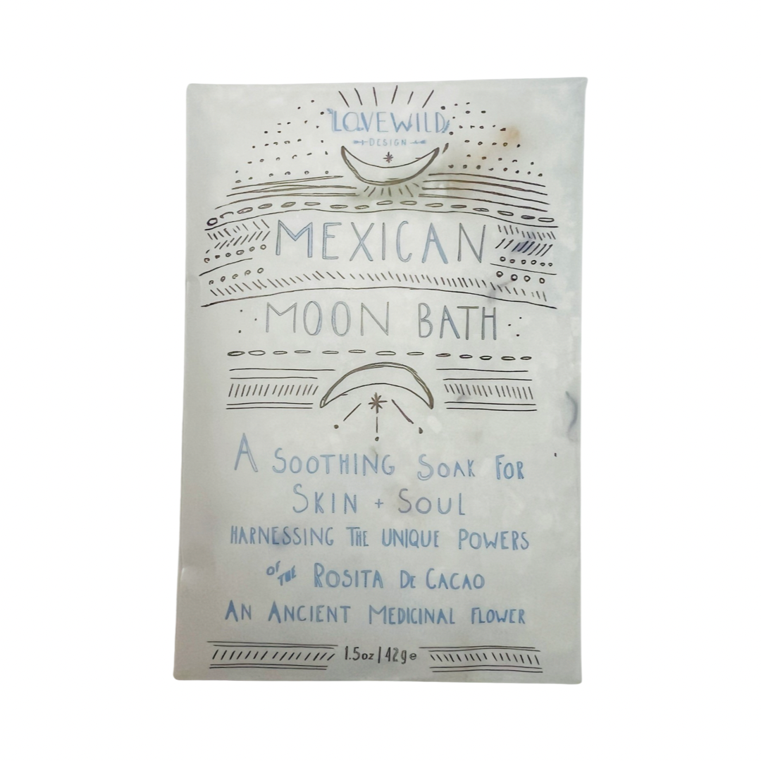 1.5 oz white pouch of bath salt with branded label in blue and black lettering. Brand: Lovewild Design