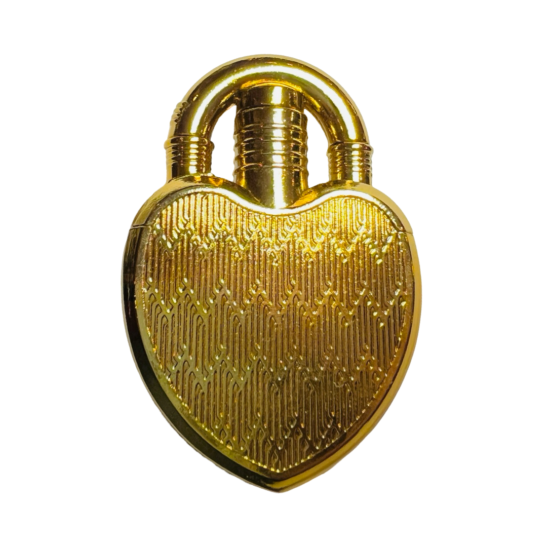 A gold heart-shaped lighter with a textured surface and a metallic finish, featuring a curved top resembling a lock.